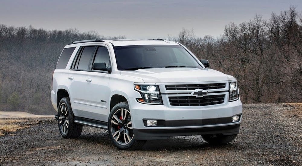 A white Chevy Tahoe on a cloudy day
