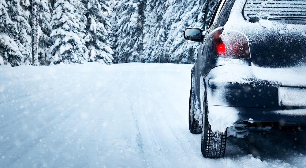 A parked black car in snowy Ohio