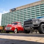 Antique Black Model TT, Red Ford 100, Black 2018 F-150 in front of Ford headquarters