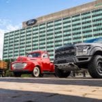 Antique Black Model TT, Red Ford 100, Black 2018 F-150 in front of Ford headquarters