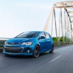 Blue 2019 Chevy Sonic driving over bridge