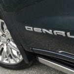 Closeup of "Denali" badge and wheel on 2019 GMC Sierra