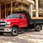Red 2019 Chevy Silverado dump truck at jobsite