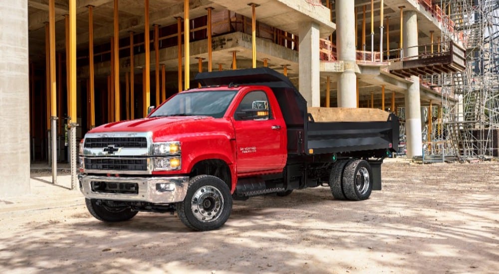 Red 2019 Chevy Silverado dump truck at jobsite