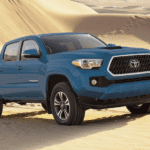 Blue 2019 Toyota Tacoma in sand dunes