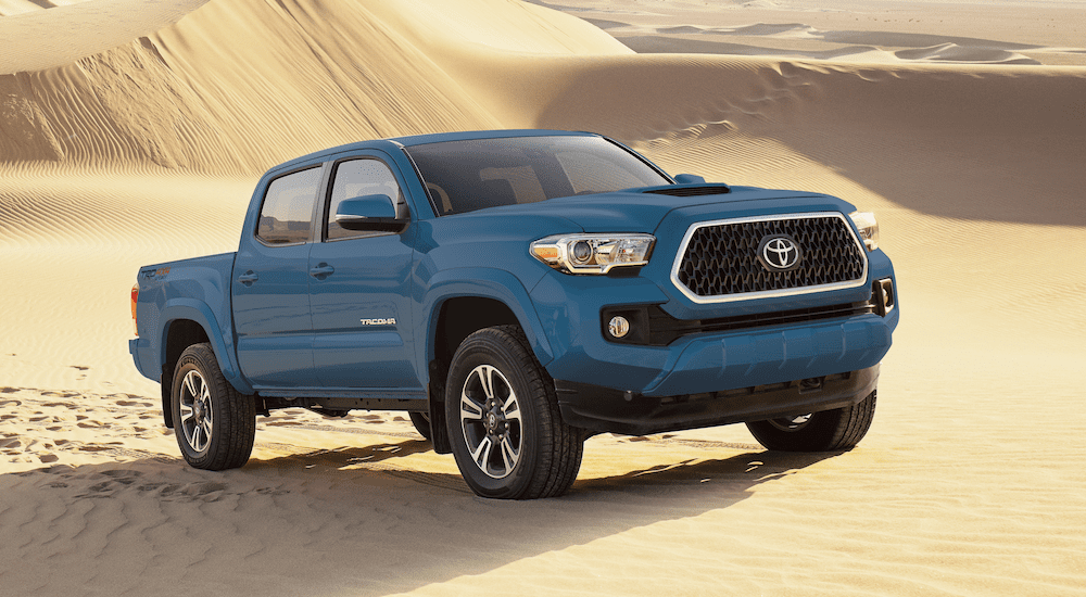 Blue 2019 Toyota Tacoma in sand dunes