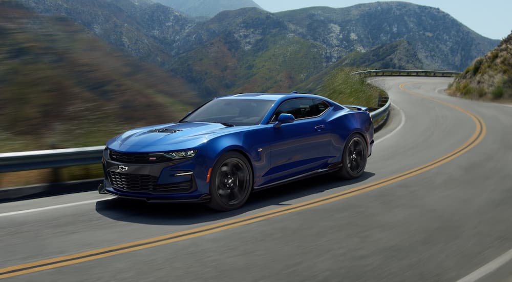 Blue 2019 Chevy Camaro on winding mountain road