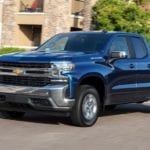 Dark blue 2019 Chevy Silverado Turbo on street