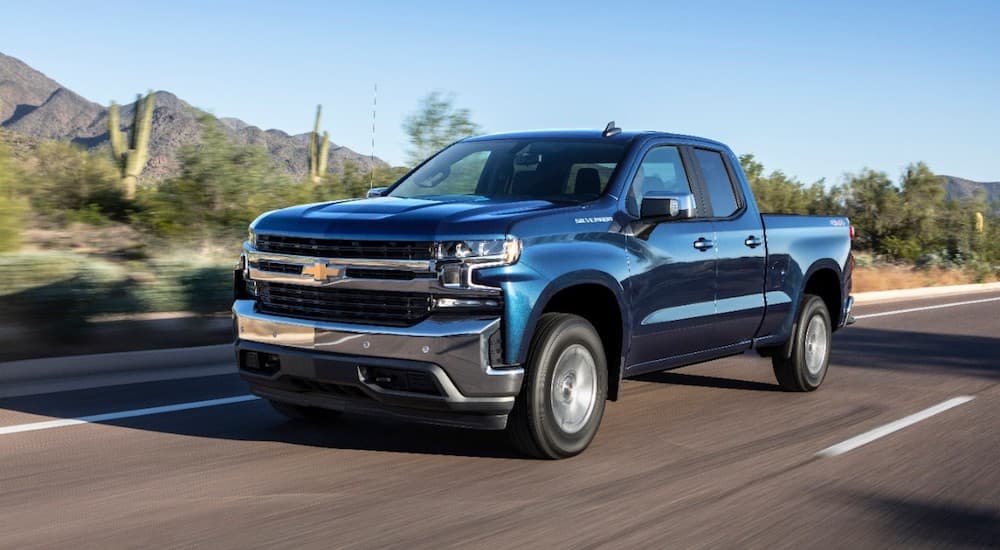 Dark blue 2019 Chevy Silverado Turbo on desert road