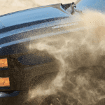 Black 2019 Chevy Silverado HD with dirt being kicked up from front wheel