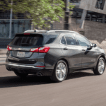 A gray 2019 Chevy Equinox driving