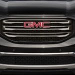 A closeup of a black 2019 GMC Acadia grille