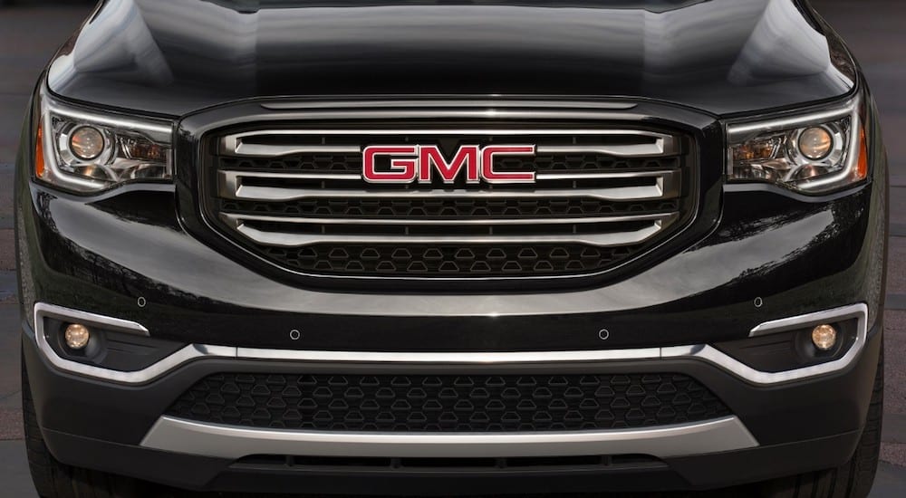 A closeup of a black 2019 GMC Acadia grille