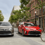 Two, red and gray, 2019 Toyota Corollas on a city street