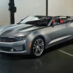 A silver 2019 Chevy Camaro RS convertible wins the 2019 Chevy Camaro vs 2019 Ford Mustang