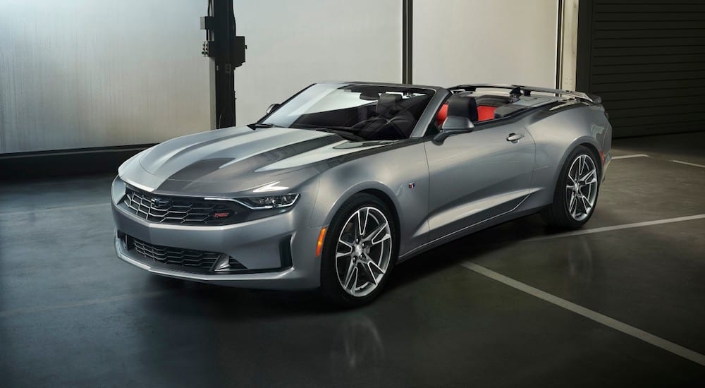 A silver 2019 Chevy Camaro RS convertible wins the 2019 Chevy Camaro vs 2019 Ford Mustang