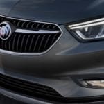 A closeup of the front end of a gray 2019 Buick Encore