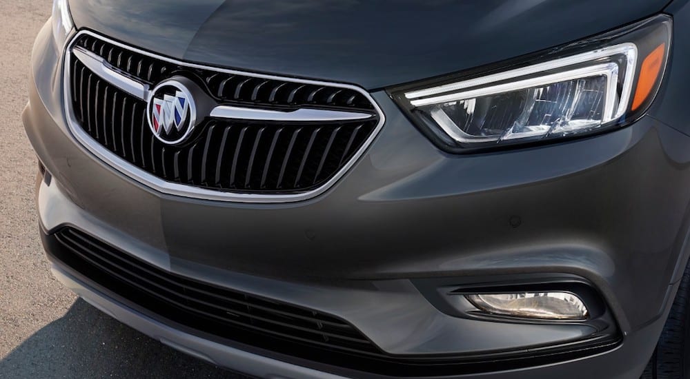 A closeup of the front end of a gray 2019 Buick Encore