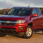 A red 2019 Chevy Colorado stand victorious as the sunset fades on 2019 Chevy Colorado vs 2019 Toyota Tacoma