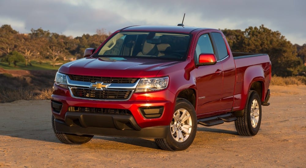 A red 2019 Chevy Colorado stand victorious as the sunset fades on 2019 Chevy Colorado vs 2019 Toyota Tacoma