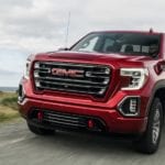 A red 2019 GMC Sierra AT4 drives off with the win for 2019 GMC Sierra 1500 vs 2019 Ford F-150