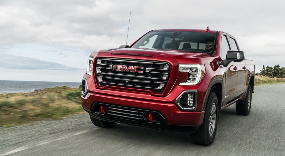 A red 2019 GMC Sierra AT4 drives off with the win for 2019 GMC Sierra 1500 vs 2019 Ford F-150