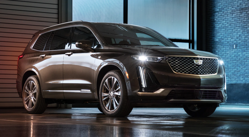 The future 2020 Cadillac XT6 is shown in a grey-brown color at night.