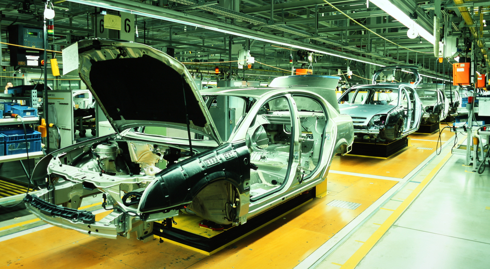 An assembly line for sedans at a plant is shown. manufacturing plants are frequently in current auto news.