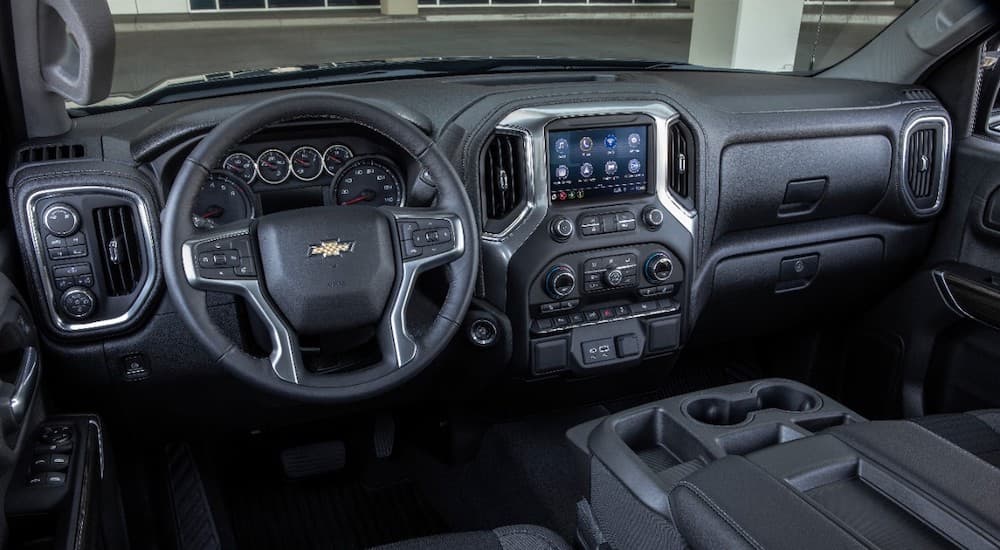 The black interior of the 2019 Chevy Silverado 1500 is shown. Check out interior features when comparing the 2019 Chevy Silverado vs 2019 Nissan Titan.
