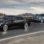 A black 2 door 2017 ATS is followed by a 4 door on the highway. Check out this model and other used Cadillacs.