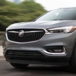 A grey 2019 Buick Enclave is shown from a front side angle driving.