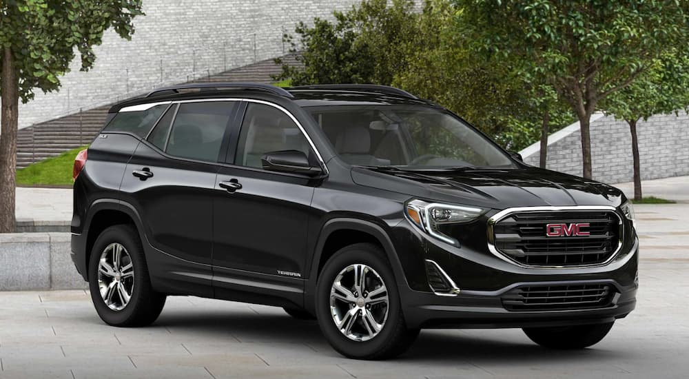 A black 2019 GMC Terrain SLE is parked.