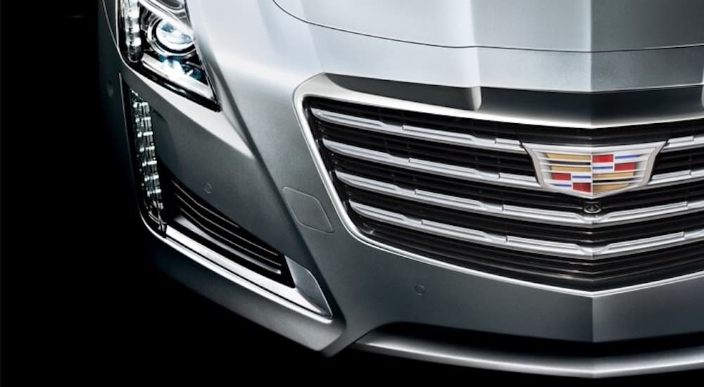 A closeup of the front of a silver 2019 Cadillac CTS is shown.