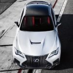 A white 2020 Lexus RCF is parked on a white strip of pavement shown from above.