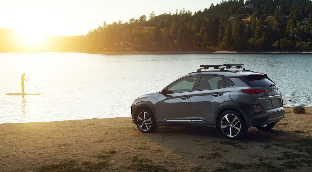 A silver 2019 Hyundai Kona is parked at a lake.