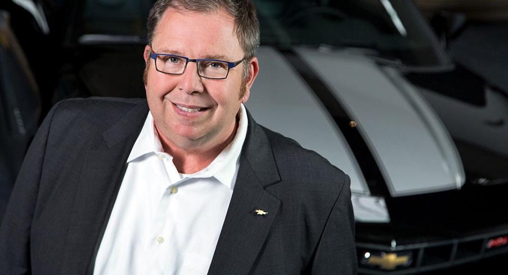 Tim Mahoney of General Motors stands next to a Chevy Camaro