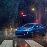Blue Toyota Prius in the Rain
