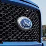 A close up of a Ford F-150 grille.