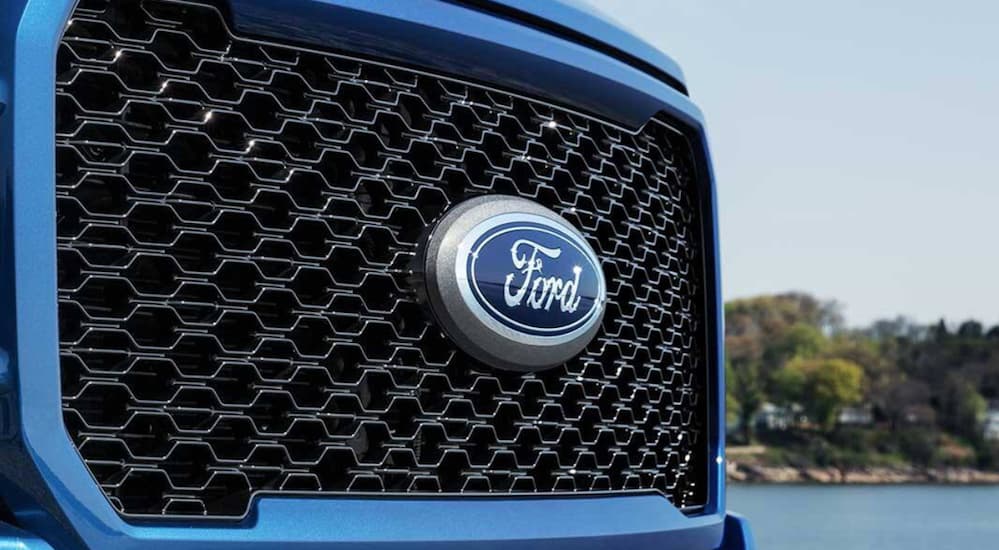 A close up of a Ford F-150 grille.