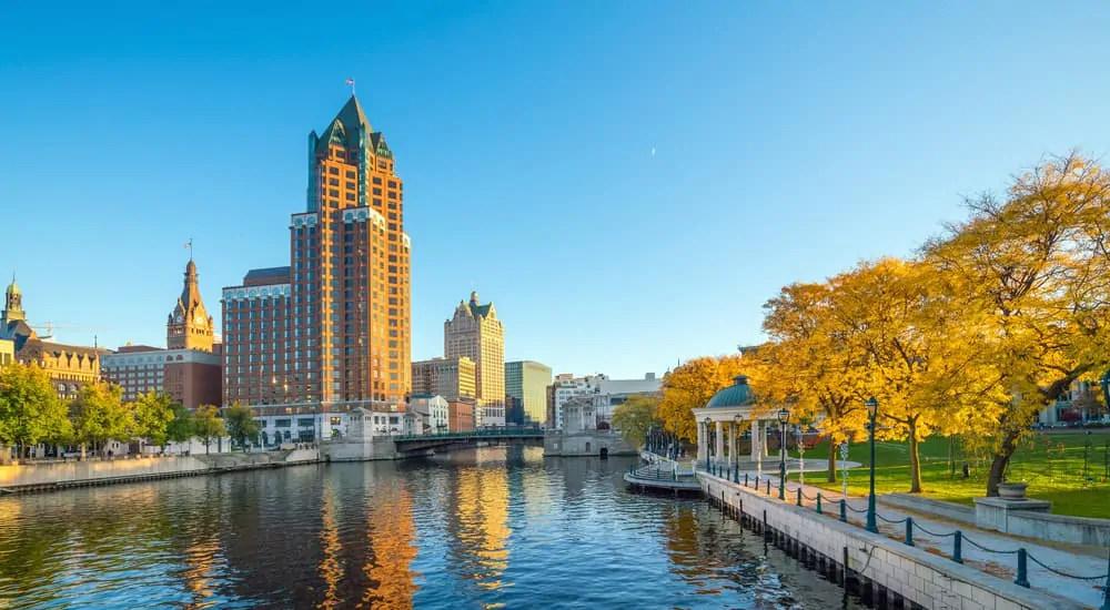 The Milwaukee River is shown along city buildings.