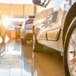 Used cars for sale are shown at a dealer.