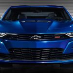 A close up of the front end of a blue 2020 Chevy Camaro is shown.