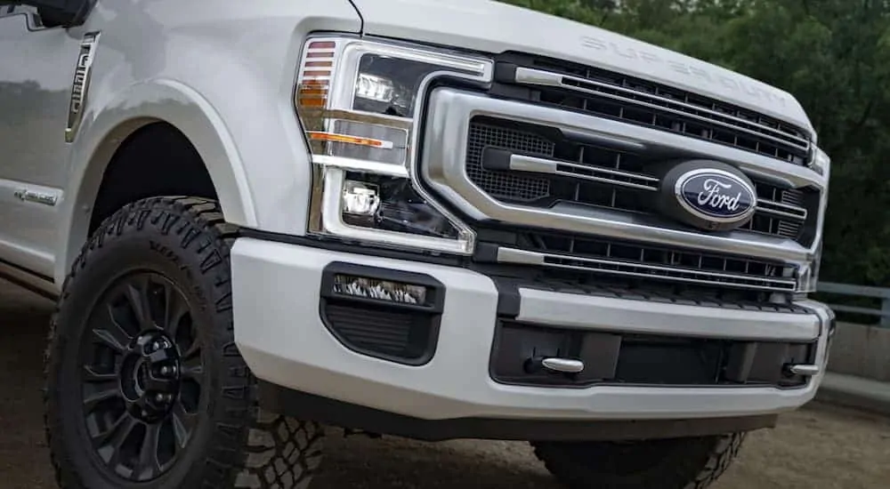 A close up of a white 2020 Ford Super Duty's grille.
