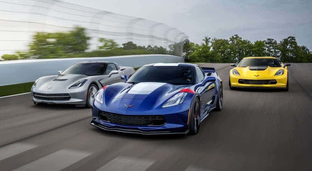 Three 2019 Chevy Corvettes are racing.