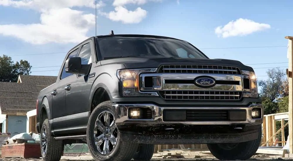 A gray 2020 Ford F-150 is parked at a construction site. 
