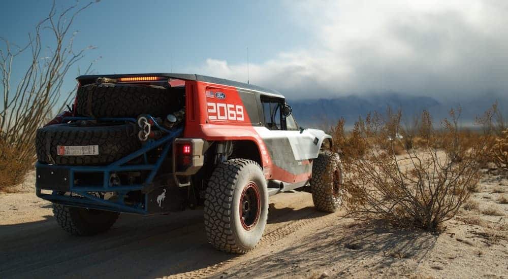 The Race Prototype of the 2020 Ford Bronco is shown from the rear in the desert.