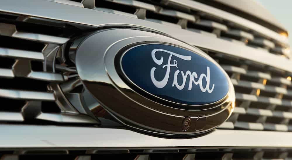 A close up of the blue Ford logo on a grille is shown.