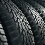 A closeup of a row of tires is shown.