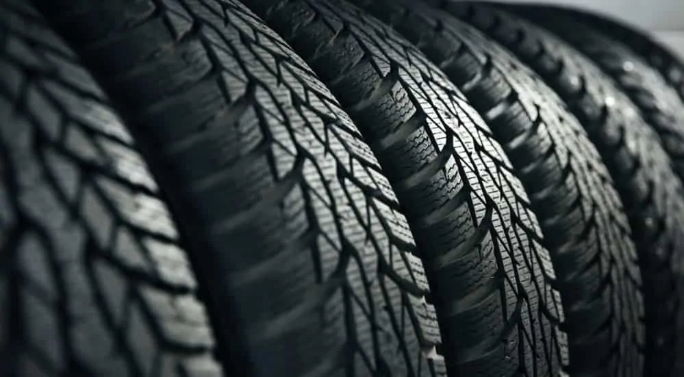 A closeup of a row of tires is shown.