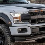 A close up of a Ford Truck's Roush grille on a white 2019 F-150 SC.